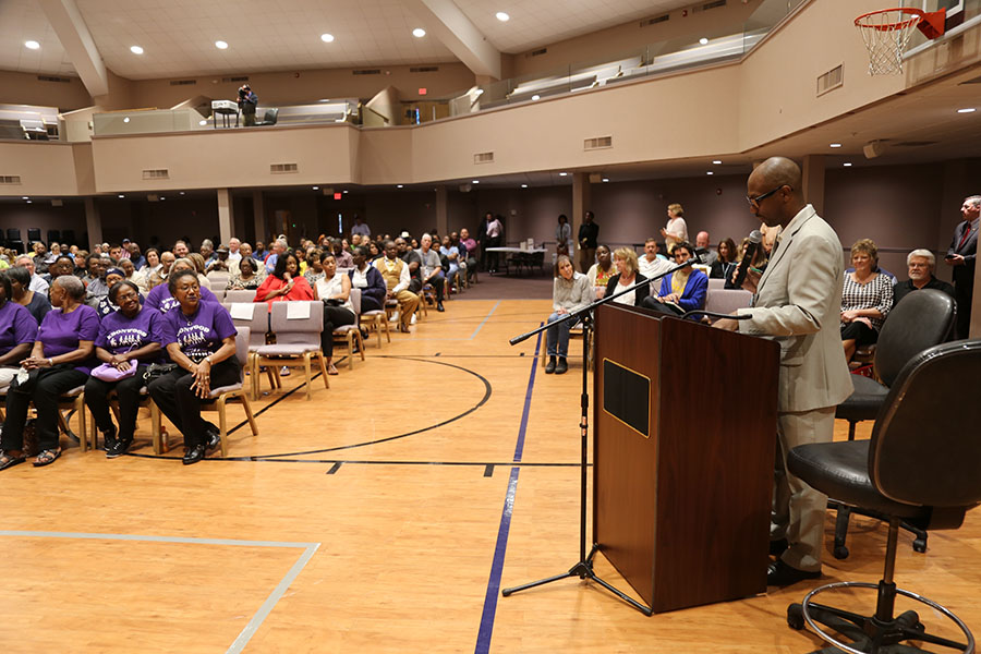 Commissioner May Speaks to the Large Crowd Attending the April 24 Town Hall Meeting with Local Officals
