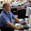 2 - Emergency Operations Center staff work at the EOC Saturday, Oct. 7, 2017 in preparation for Hurricane Nate.
