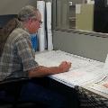 Survey Staff Member Working on Plat Review